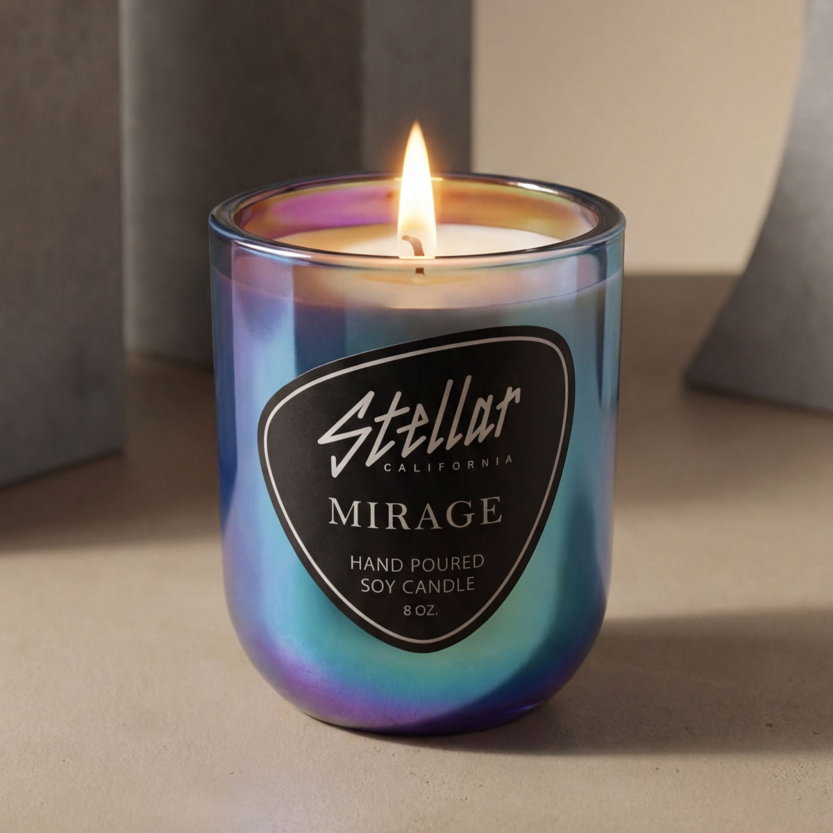 “Color-shifting luxury candle in iridescent glass.”