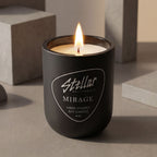 “Luxury warm candle in matte black glass vessel.”