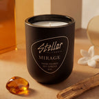 “Mirage matte black candle with warm jasmine and amber scent.”
