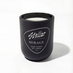 “Mirage candle with earthy amber and leather notes.”