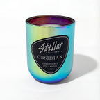 “Luxury color-shifting candle with nocturnal coastal scent.”