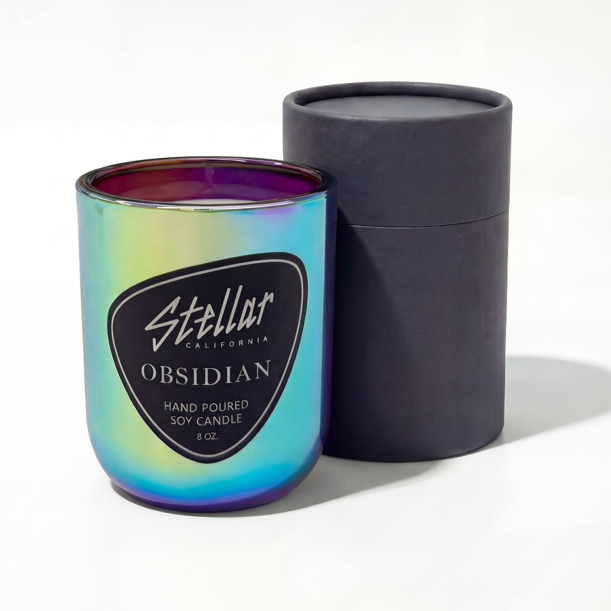“Stellar California Obsidian candle in iridescent glass vessel.”