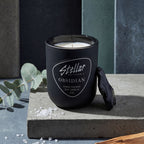 “Obsidian candle featuring matte black glass and premium cotton wick.”