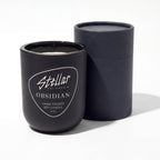 “Stellar California Obsidian candle in matte black vessel.”