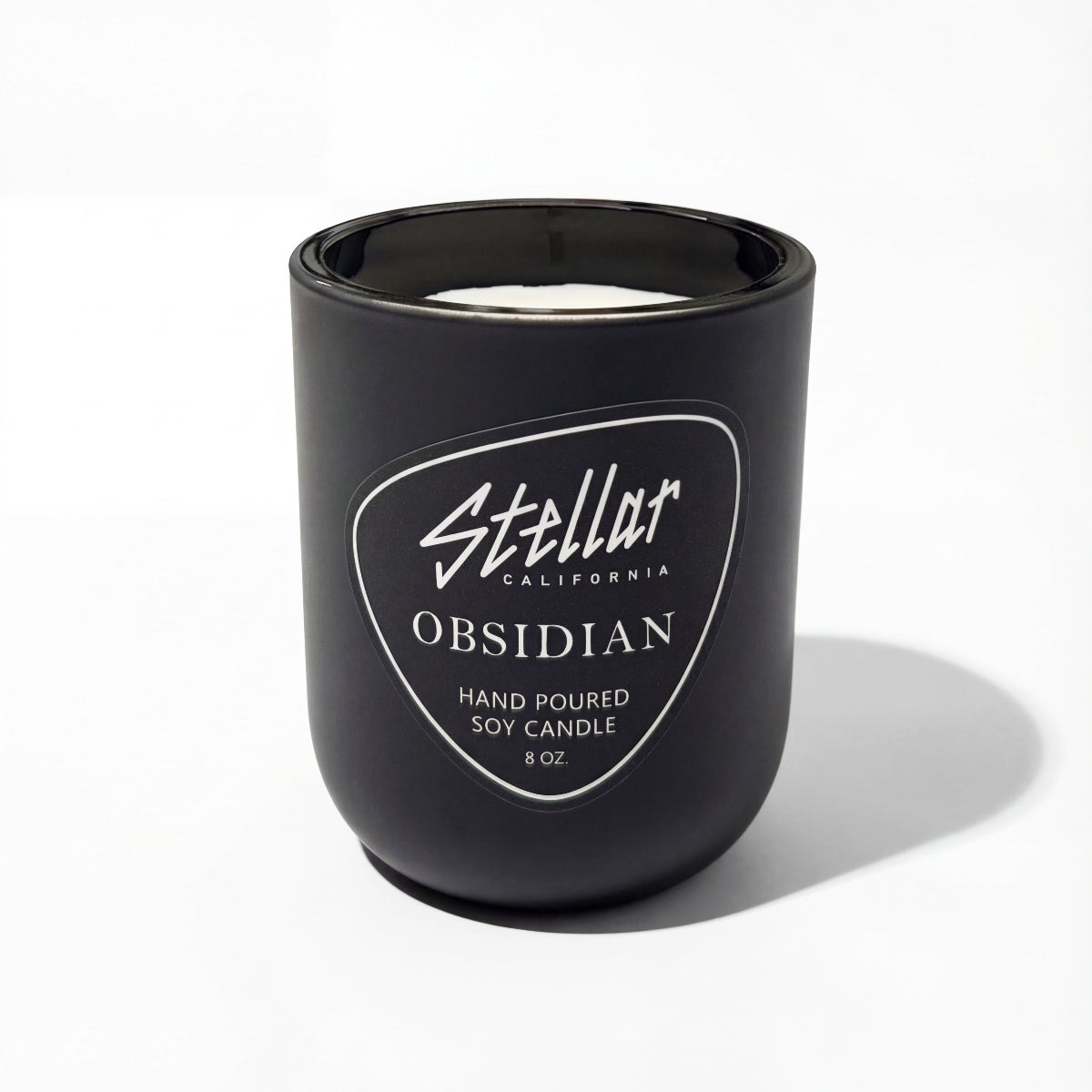 “Luxury soy–coconut blend candle with nocturnal coastal fragrance.”