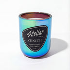 “Zenith chromatic candle with green and blue iridescent reflections.”